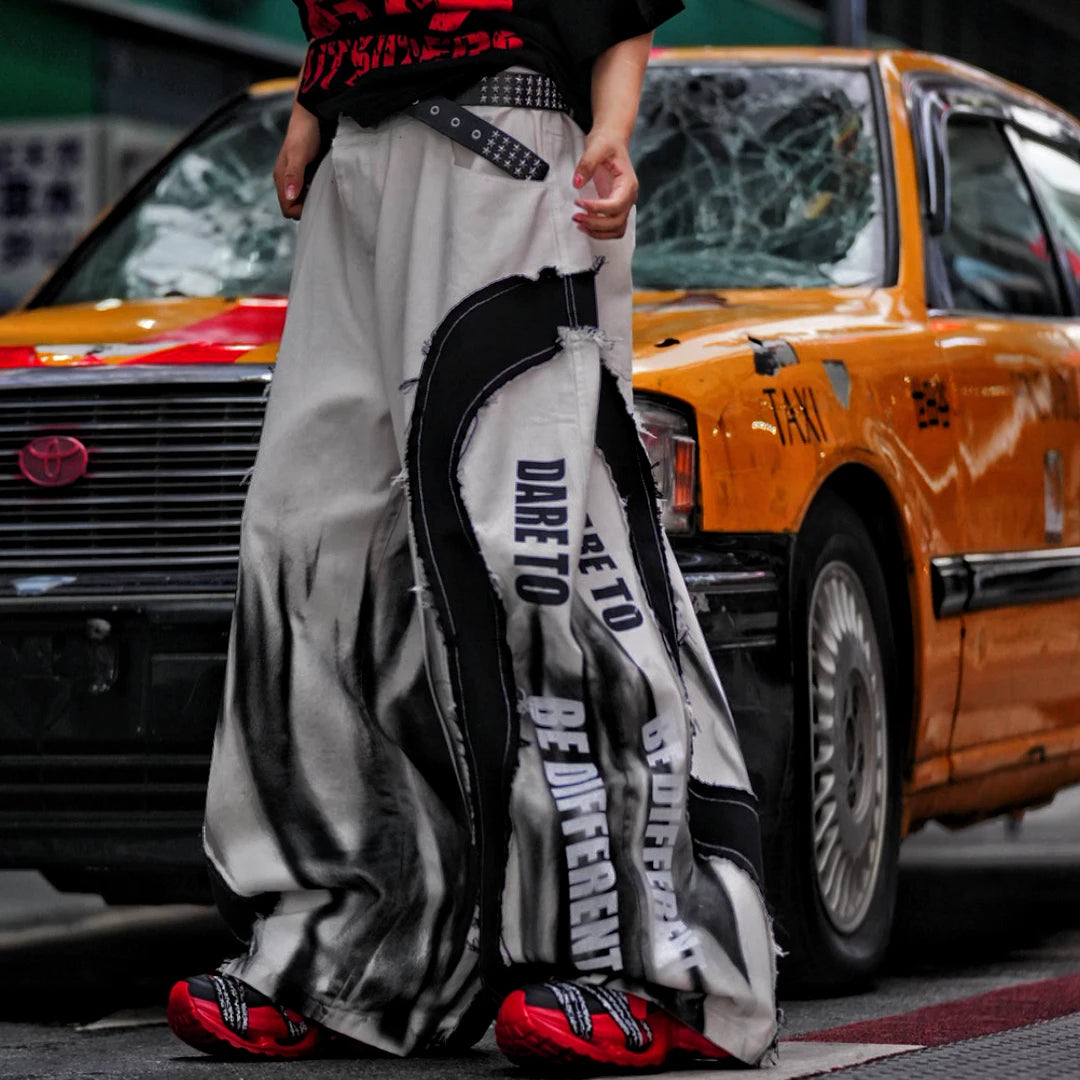 Sanhoostudio denim pants featuring distressed wash effects, wide leg scythe-cut tailoring, and a relaxed fit silhouette. Built for everyday streetwear outfits with comfort, durability, and modern styling.