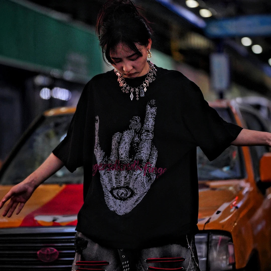 Sanhoostudio short sleeve T-shirt featuring fingerprint-inspired spray print artwork, breathable fabric construction, and a relaxed oversized fit. Designed for modern streetwear styling with all-day comfort, lightweight wearability, and standout graphic appeal for summer outfits.