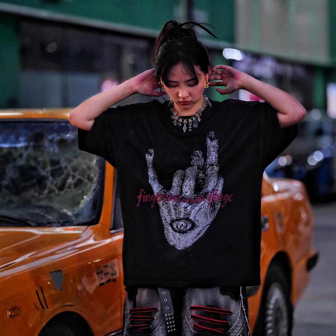 Sanhoostudio short sleeve T-shirt featuring fingerprint-inspired spray print artwork, breathable fabric construction, and a relaxed oversized fit. Designed for modern streetwear styling with all-day comfort, lightweight wearability, and standout graphic appeal for summer outfits.