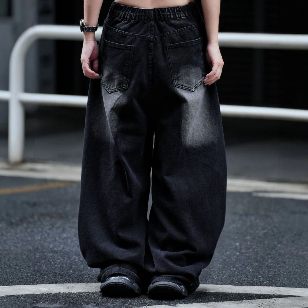 Sanhoostudio wide leg pants featuring heavyweight graphic print detailing and a relaxed loose-fit silhouette. Designed for modern streetwear outfits with comfortable drape, lightweight summer wearability, and standout visual appeal.
