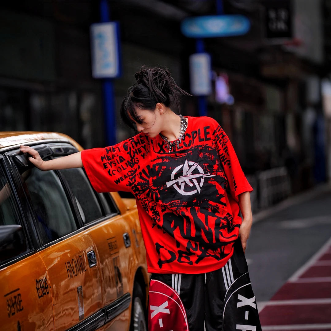 Sanhoostudio short sleeve T-shirt featuring spray-print artwork, breathable fabric construction, and an oversized fit silhouette. Designed for modern streetwear styling with comfort and standout summer appeal.
