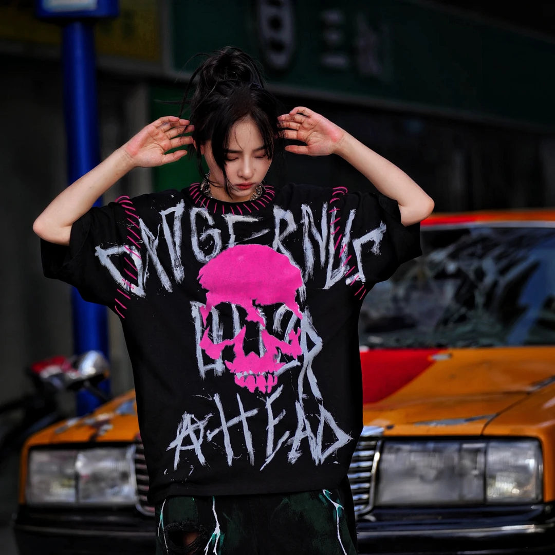 Sanhoostudio short sleeve T-shirt featuring graphic spray-print detailing and a relaxed oversized silhouette. Built for streetwear outfits with breathable comfort, lightweight construction, and versatile everyday styling.