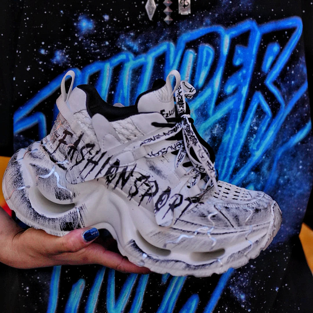 Sanhoostudio dad sneakers featuring grey and white graffiti-inspired detailing, cushioned sole construction, and a modern streetwear silhouette. Designed for everyday comfort, versatile styling, and standout urban fashion appeal with all-day wearability.