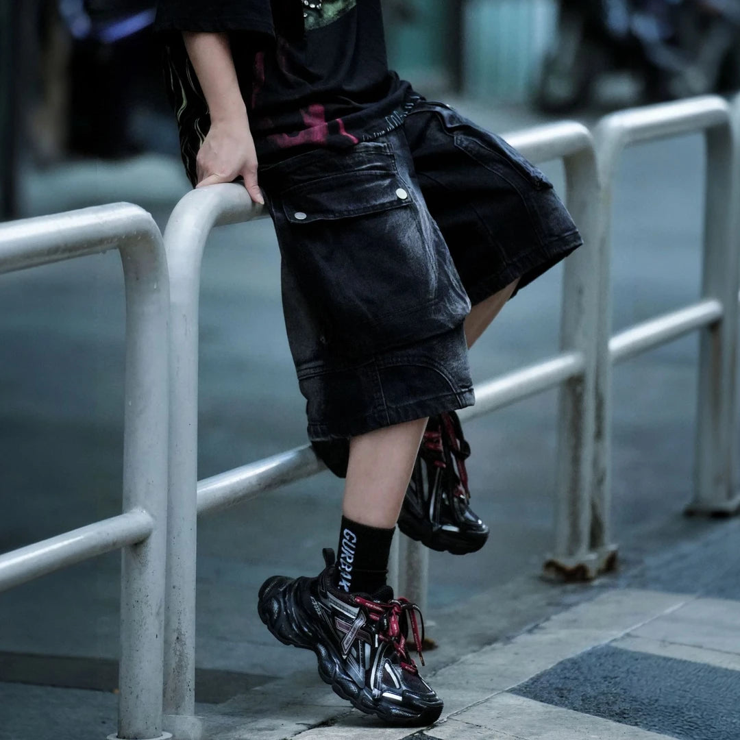 Sanhoostudio cargo shorts featuring washed fabric treatment, oversized pocket detailing, and a relaxed wide leg silhouette. Designed for summer streetwear styling with breathable comfort, lightweight wearability, and a bold urban aesthetic for everyday outfits.