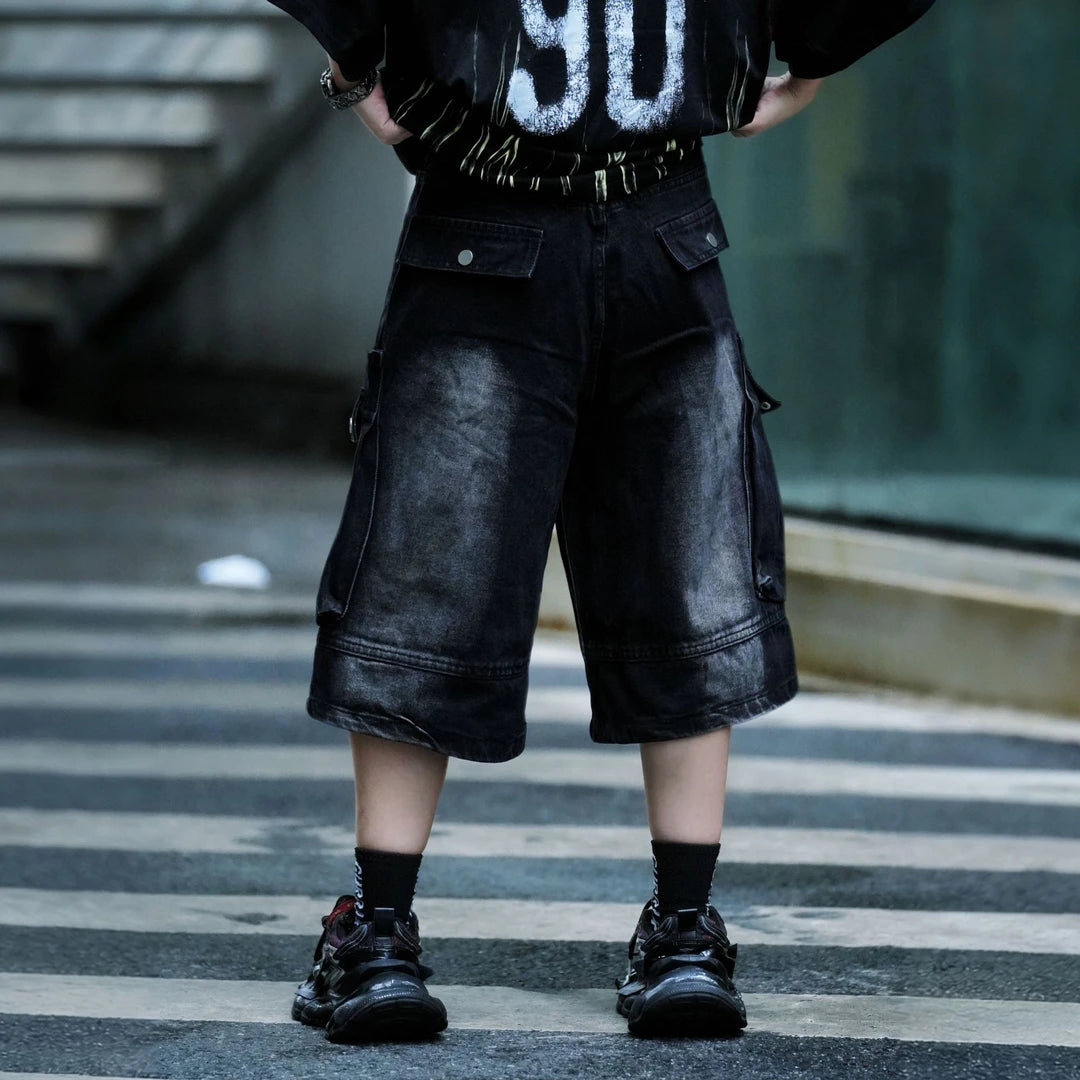 Sanhoostudio cargo shorts featuring washed fabric treatment, oversized pocket detailing, and a relaxed wide leg silhouette. Designed for summer streetwear styling with breathable comfort, lightweight wearability, and a bold urban aesthetic for everyday outfits.