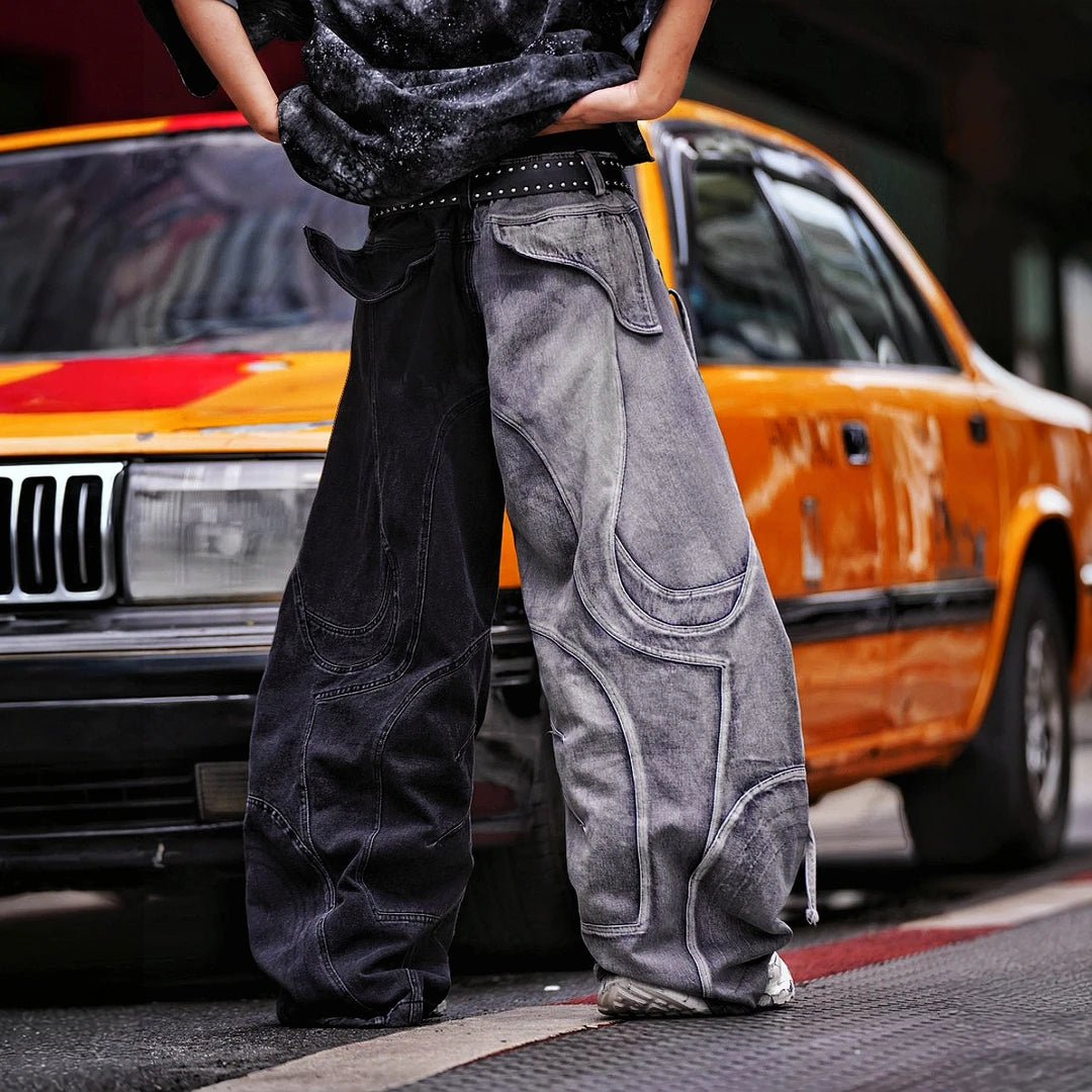 Sanhoostudio denim pants featuring distressed wash treatment, contrast panel construction, and a wide leg scythe-cut silhouette. Designed for futuristic streetwear styling with relaxed comfort and distinctive everyday appeal.