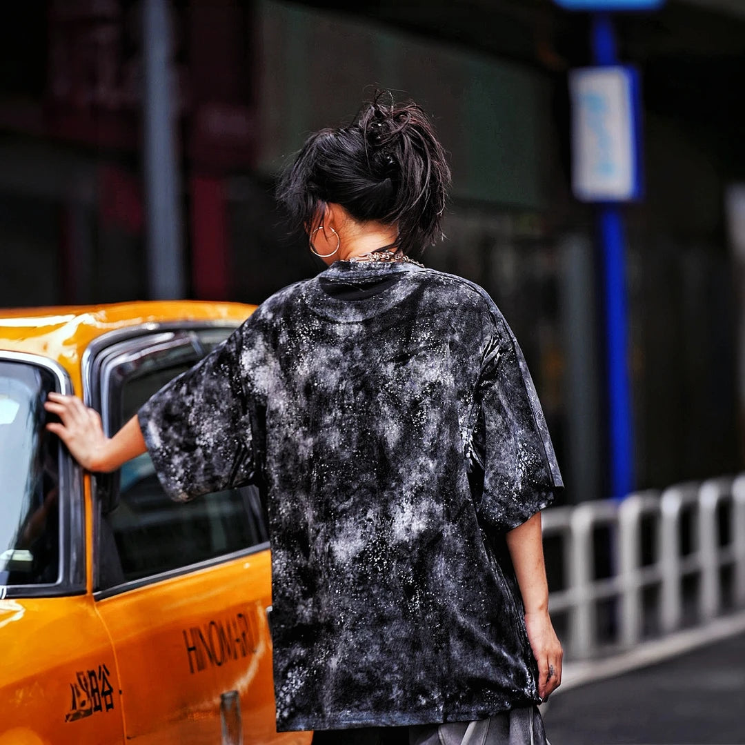 Sanhoostudio short sleeve T-shirt featuring stitch-inspired graphics, hand-painted detailing, and an oversized relaxed fit. Designed for modern streetwear styling with breathable fabric, lightweight comfort, and eye-catching graphic appeal.