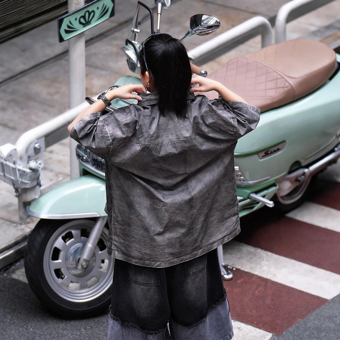 Sanhoostudio short sleeve shirt featuring vintage streetwear styling, a relaxed oversized silhouette, and lightweight breathable fabric. Perfect for casual summer outfits with timeless design and everyday comfort.