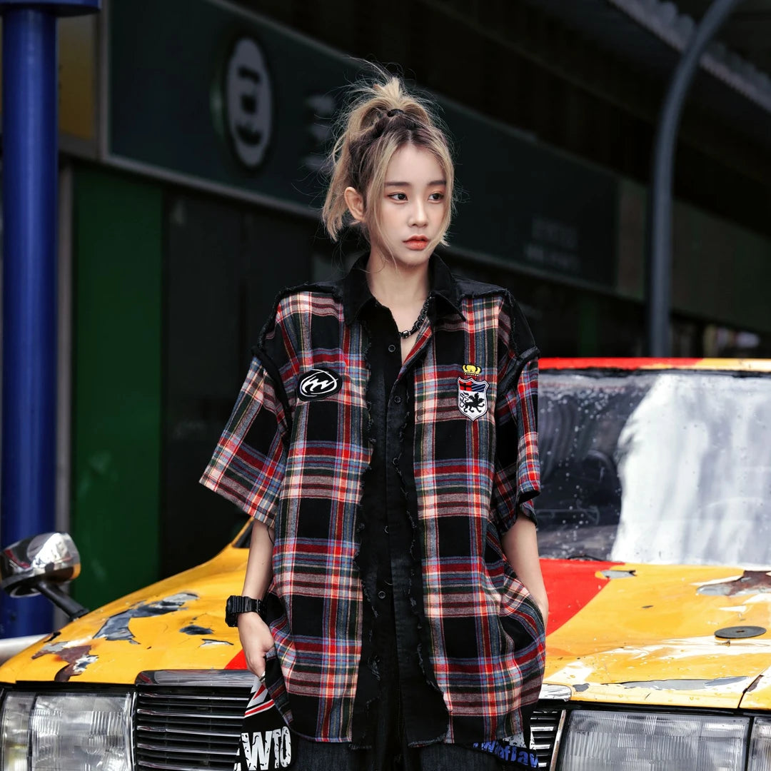 Sanhoostudio short sleeve shirt featuring plaid patchwork construction, distressed vintage details, and a relaxed oversized fit. Designed for versatile summer streetwear outfits with breathable comfort and timeless styling.