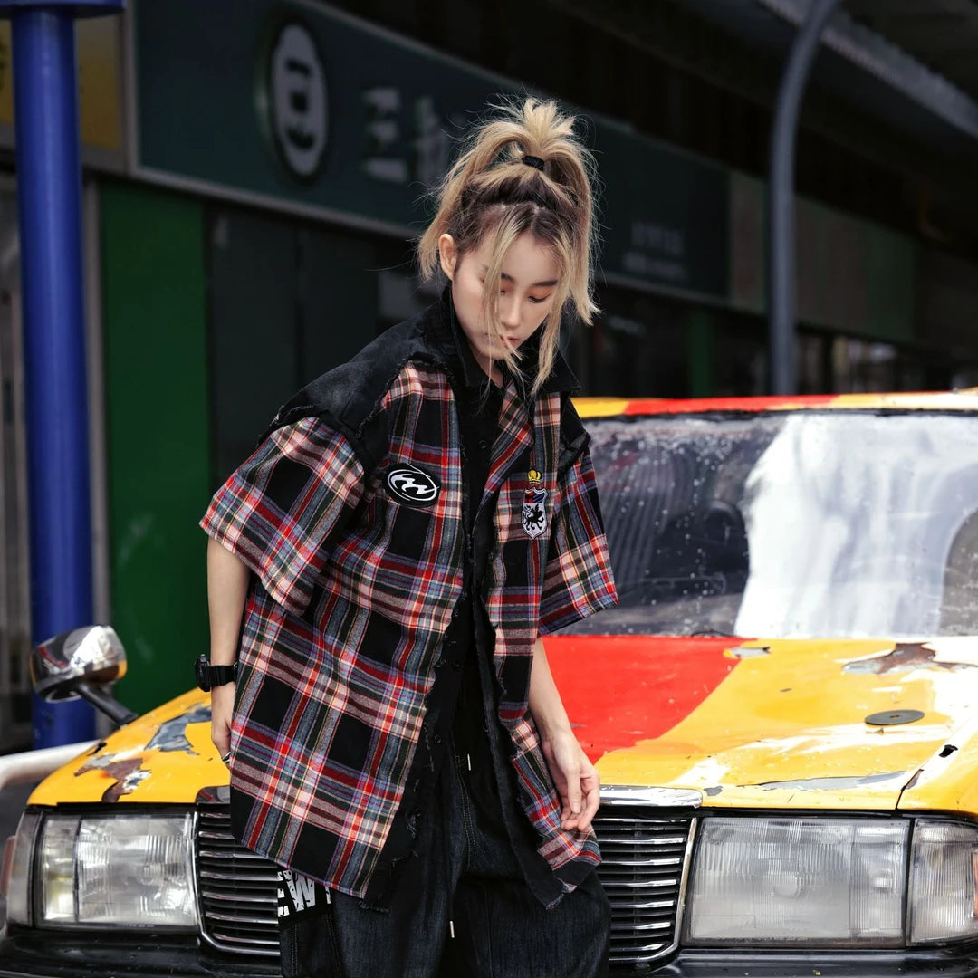 Sanhoostudio short sleeve shirt featuring plaid patchwork construction, distressed vintage details, and a relaxed oversized fit. Designed for versatile summer streetwear outfits with breathable comfort and timeless styling.