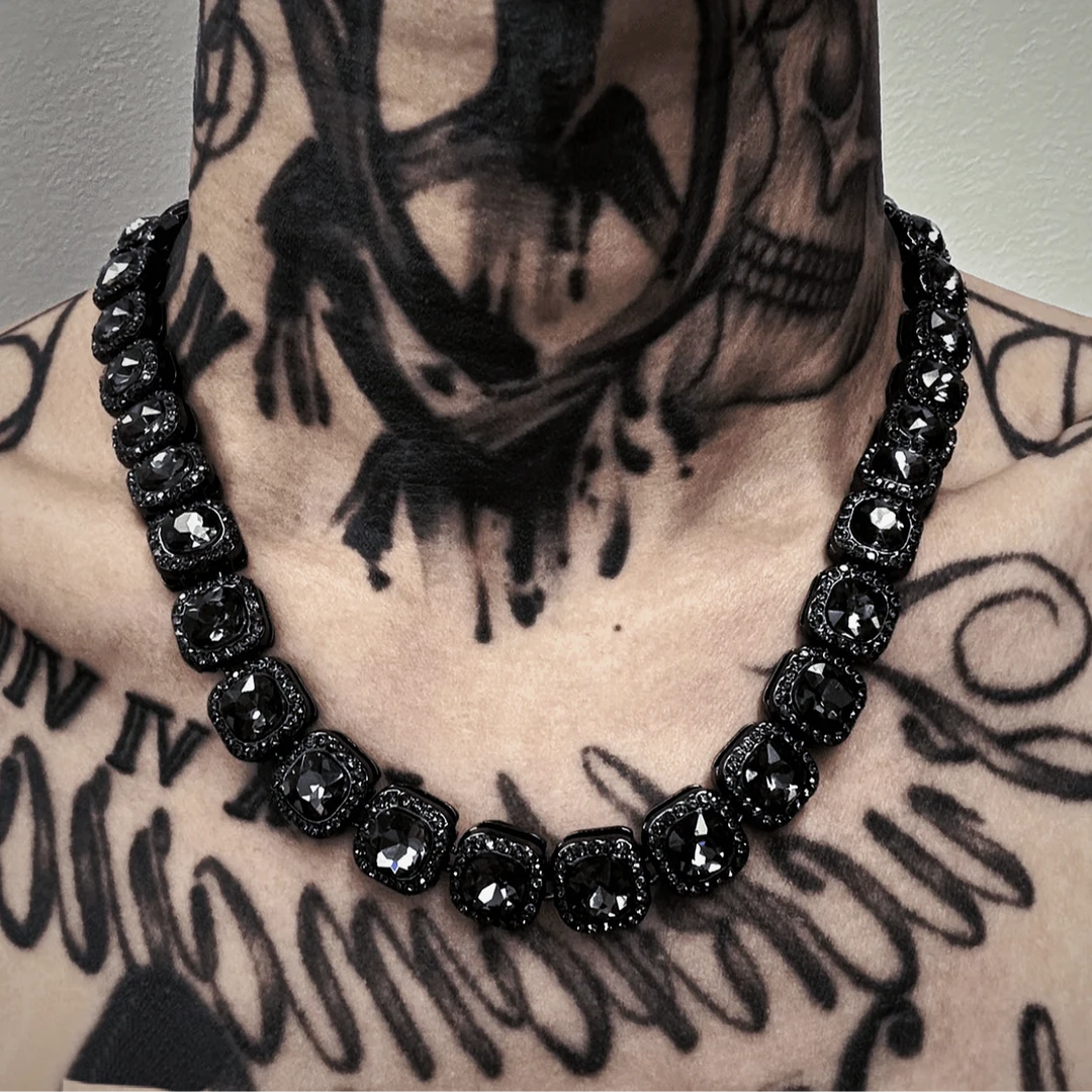 Sanhoostudio alloy necklace featuring crystal-inspired square pendant details and a sleek chain design. Crafted for effortless layering with streetwear outfits, offering lightweight comfort and a modern fashion-forward look for everyday styling.
