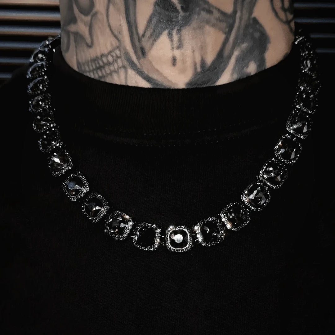 Sanhoostudio alloy necklace featuring crystal-inspired square pendant details and a sleek chain design. Crafted for effortless layering with streetwear outfits, offering lightweight comfort and a modern fashion-forward look for everyday styling.