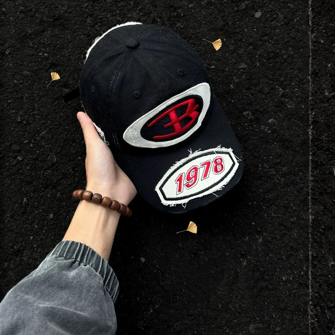 Sanhoostudio baseball cap featuring premium embroidered detailing, a classic curved brim, and an adjustable fit. Designed for everyday streetwear styling with comfortable wear and timeless vintage appeal.
