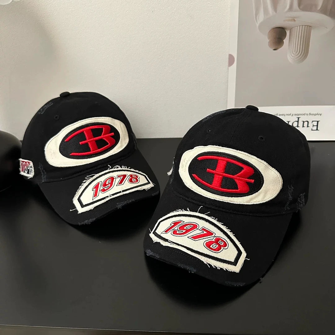 Sanhoostudio baseball cap featuring premium embroidered detailing, a classic curved brim, and an adjustable fit. Designed for everyday streetwear styling with comfortable wear and timeless vintage appeal.