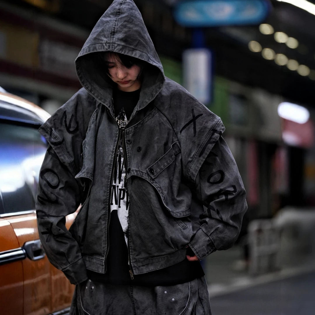 Sanhoostudio denim jacket featuring grey and black tones, hand-painted graffiti artwork, distressed staining, mud-dye treatment, and a relaxed oversized silhouette. Designed for statement streetwear layering with rich visual texture, vintage character, and bold urban appeal.