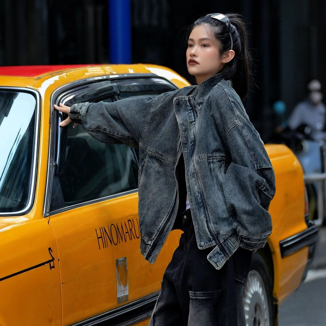 Sanhoostudio denim jacket featuring vintage washed treatment, patchwork construction, a structured stand collar, and a relaxed oversized silhouette. Designed for statement streetwear layering with rugged denim texture, comfortable wear, and versatile urban styling.