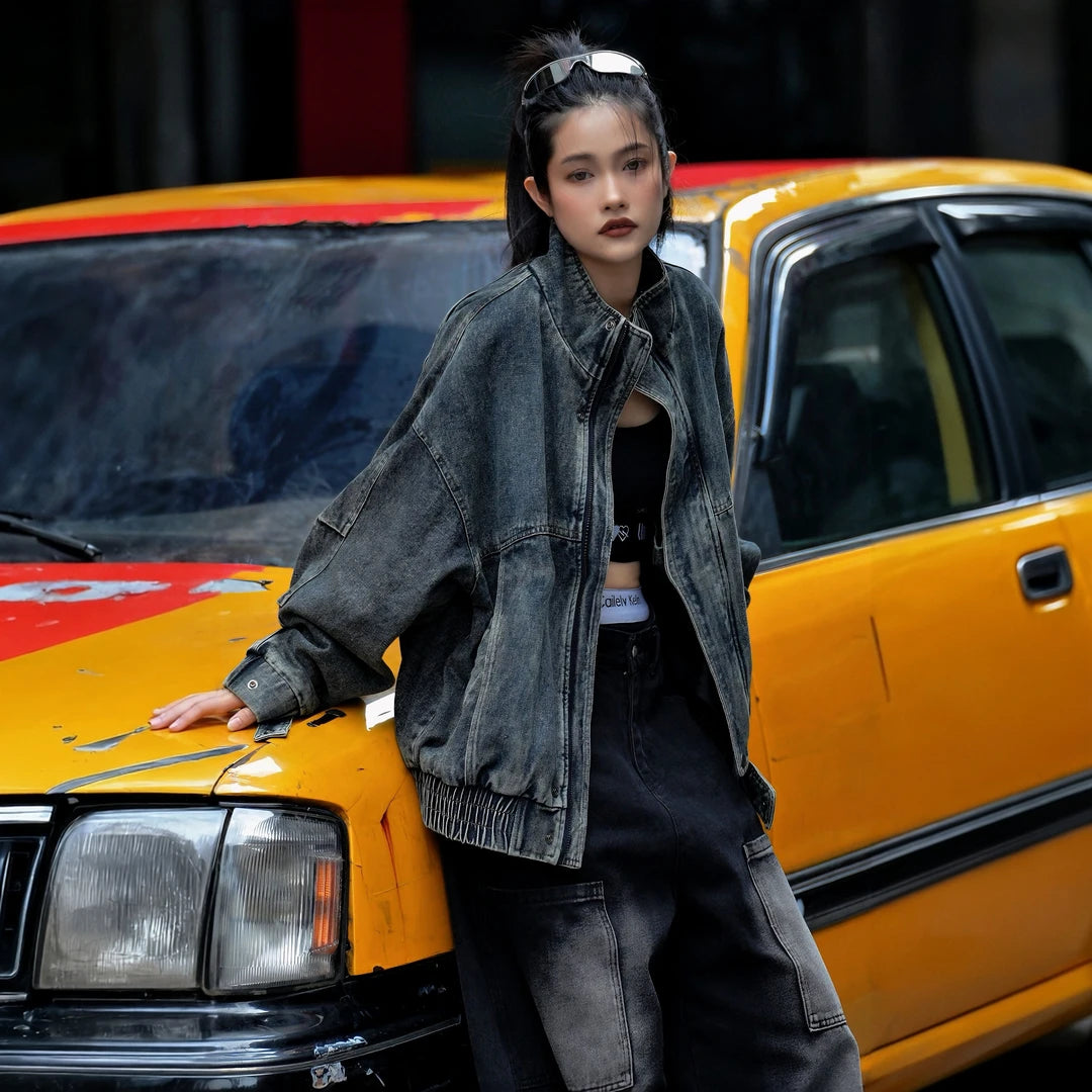 Sanhoostudio denim jacket featuring vintage washed treatment, patchwork construction, a structured stand collar, and a relaxed oversized silhouette. Designed for statement streetwear layering with rugged denim texture, comfortable wear, and versatile urban styling.