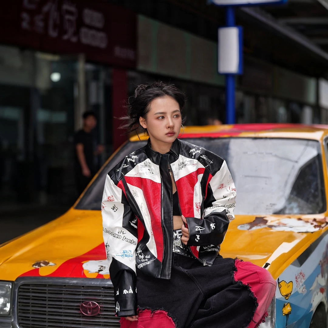 Sanhoostudio PU racing jacket featuring F2-inspired motorsport styling, contrast patchwork construction, and a relaxed oversized silhouette. Designed for early fall streetwear layering with bold racing character, comfortable movement, and distinctive urban appeal.