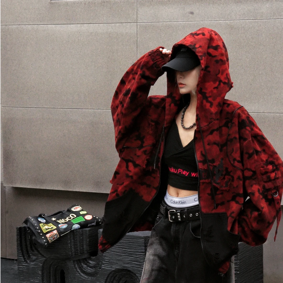 Sanhoostudio denim jacket featuring red camouflage graphics, distressed wash treatment, and a relaxed oversized silhouette. Designed for fall and winter streetwear layering with rugged vintage texture, bold visual character, and comfortable everyday styling.
