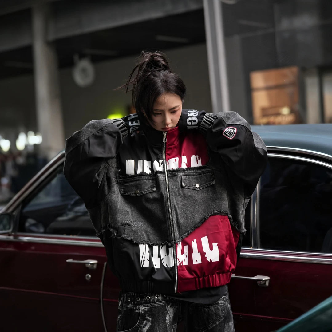 Sanhoostudio denim jacket featuring black patch applique embroidery, distressed surface detailing, and a relaxed oversized silhouette with added seasonal warmth. Designed for statement streetwear layering with rugged texture, handcrafted character, and versatile urban styling.