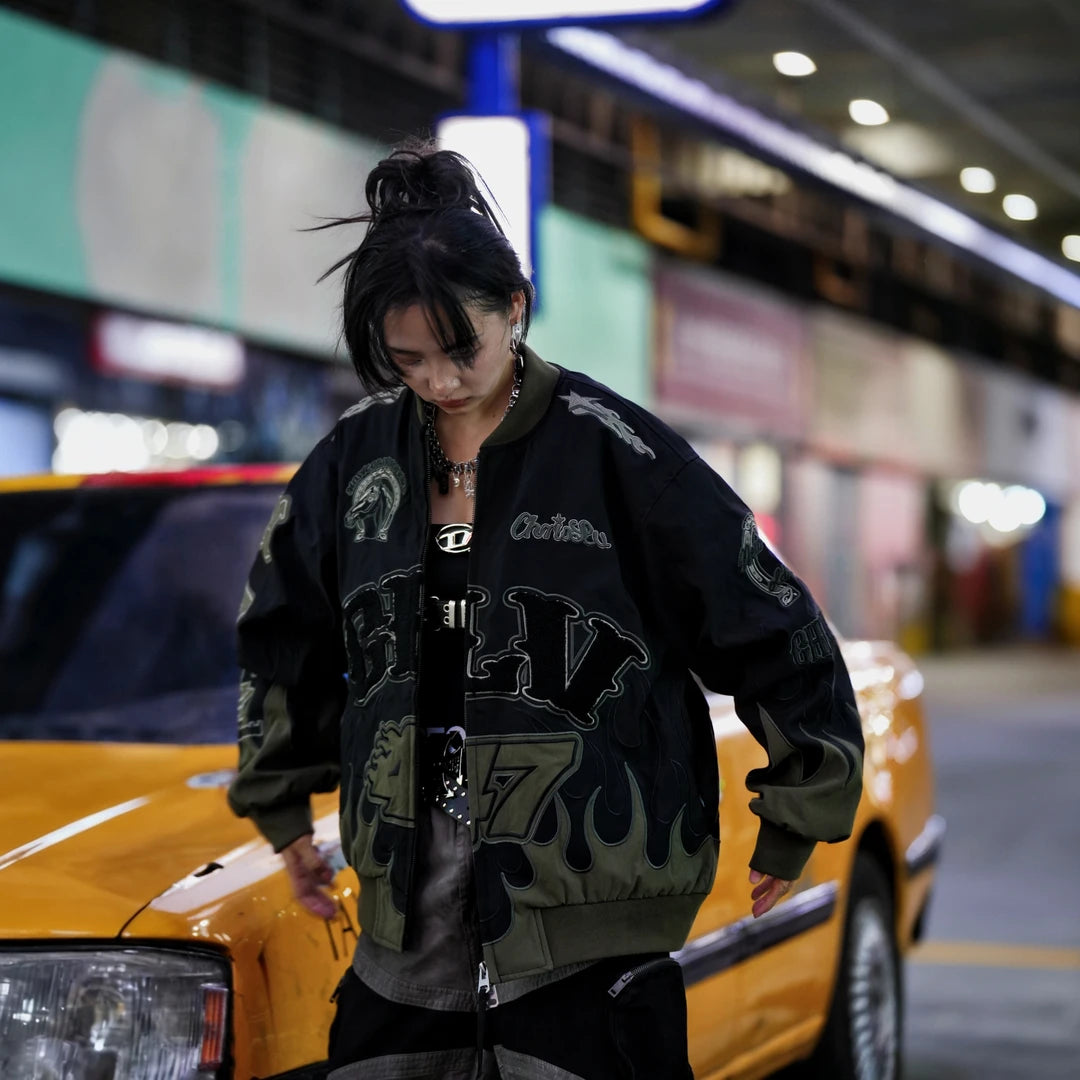 Sanhoostudio padded jacket featuring warhorse-inspired embroidery, contrast patchwork detailing, and a relaxed oversized silhouette. Designed for colder-season streetwear layering with vintage character, comfortable warmth, bold embroidered artwork, and distinctive everyday urban styling.