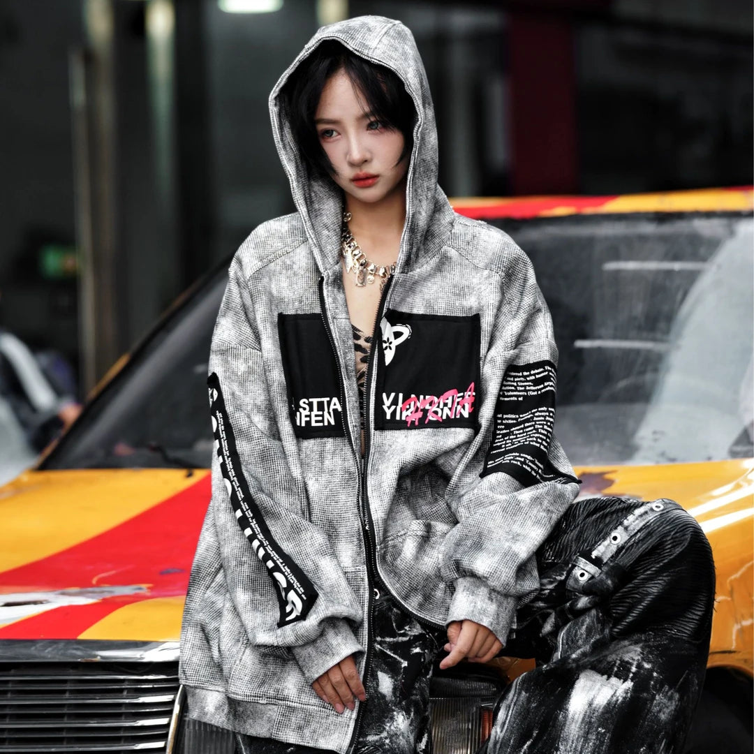 Sanhoostudio zip hoodie featuring a meteor grey colorway, statement graphic artwork, and a relaxed wide oversized silhouette. Designed for contemporary streetwear layering with comfortable everyday wear, bold visual character, and versatile urban styling.