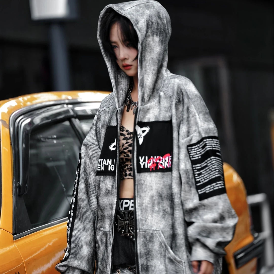 Sanhoostudio zip hoodie featuring a meteor grey colorway, statement graphic artwork, and a relaxed wide oversized silhouette. Designed for contemporary streetwear layering with comfortable everyday wear, bold visual character, and versatile urban styling.