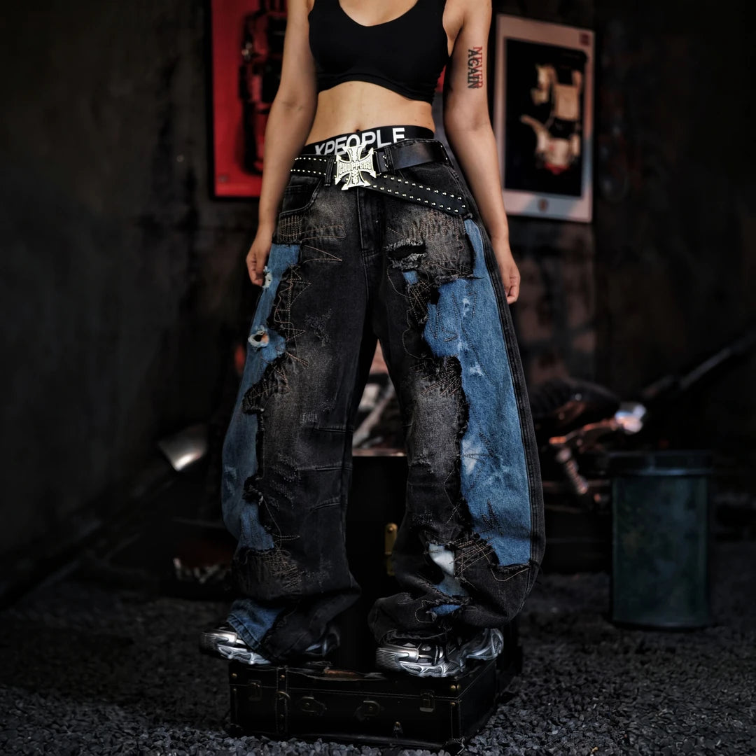 Sanhoostudio denim pants featuring vintage washed treatment, distressed detailing, asymmetric patchwork construction, and a relaxed silhouette. Designed for statement streetwear styling with rugged denim texture, unconventional panel structure, comfortable movement, and distinctive everyday urban appeal.