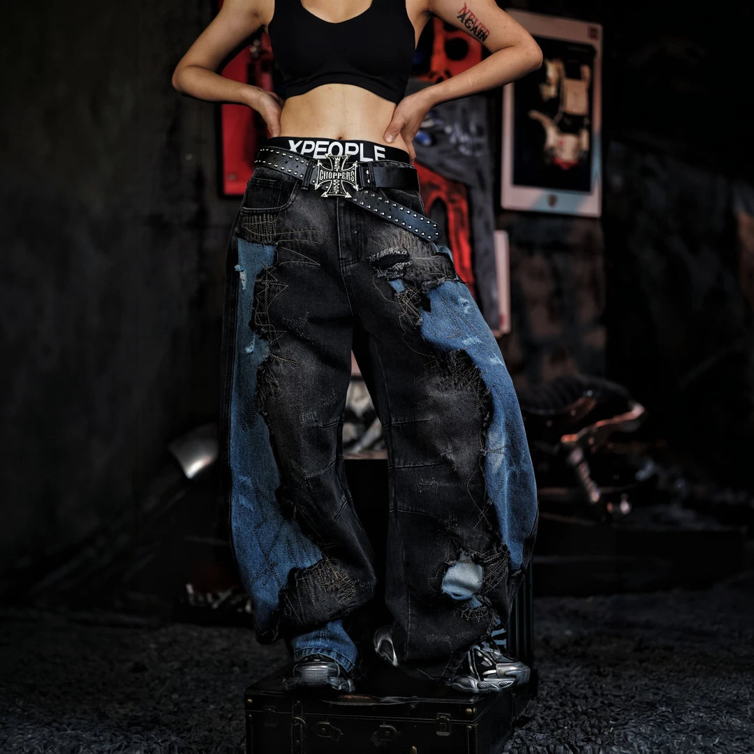 Sanhoostudio denim pants featuring vintage washed treatment, distressed detailing, asymmetric patchwork construction, and a relaxed silhouette. Designed for statement streetwear styling with rugged denim texture, unconventional panel structure, comfortable movement, and distinctive everyday urban appeal.