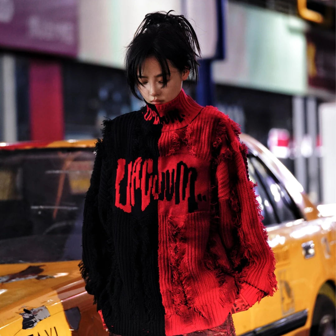 Sanhoostudio knit sweater featuring a bold black and red colorway, heavyweight woven construction, distressed graffiti artwork, hand-painted detailing, and asymmetric patchwork elements. Designed with a relaxed oversized silhouette for statement streetwear styling and distinctive deconstructed appeal.