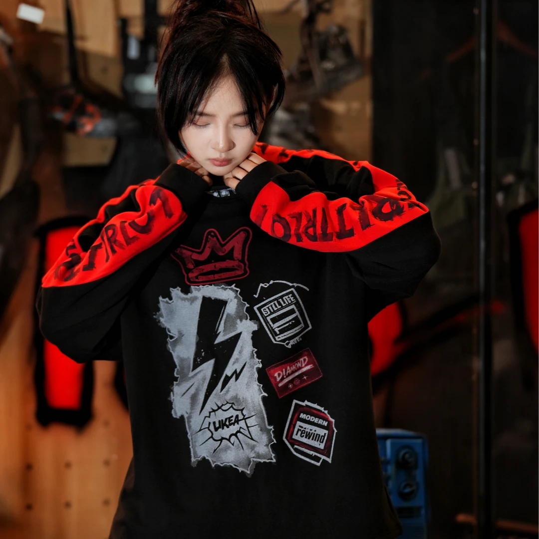 Sanhoostudio thermal long sleeve T-shirt featuring graffiti-inspired scan graphics, soft thermal fabric, asymmetric detailing, and a relaxed oversized silhouette. Designed for contemporary streetwear layering with comfortable warmth, distinctive digital artwork, and versatile everyday styling.