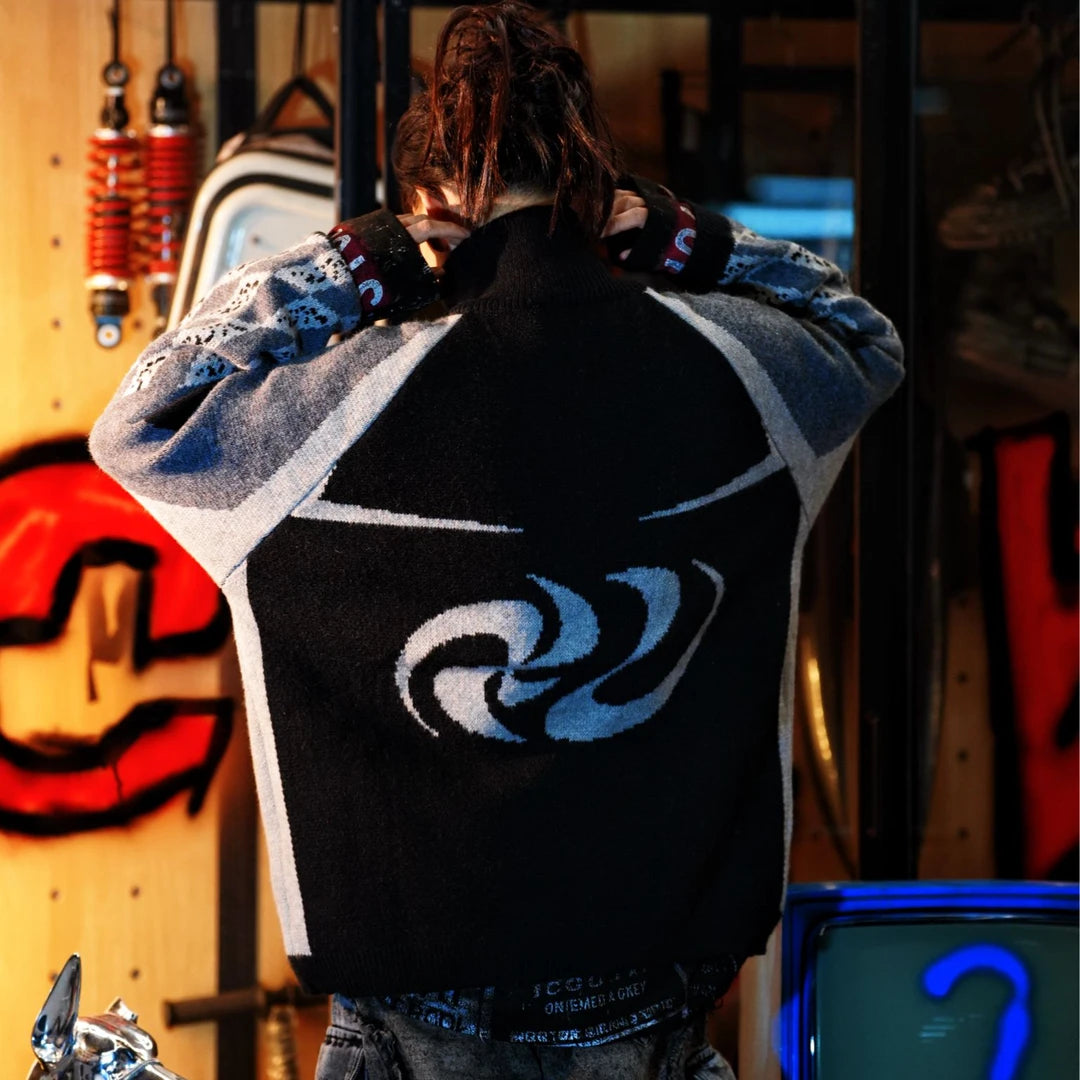 Sanhoostudio knit sweater featuring heavyweight knitted construction, hand-painted graphic detailing, asymmetric patchwork elements, and a relaxed oversized silhouette. Designed for statement streetwear styling with distinctive artistic textures, comfortable warmth, deconstructed aesthetics, and versatile layering.