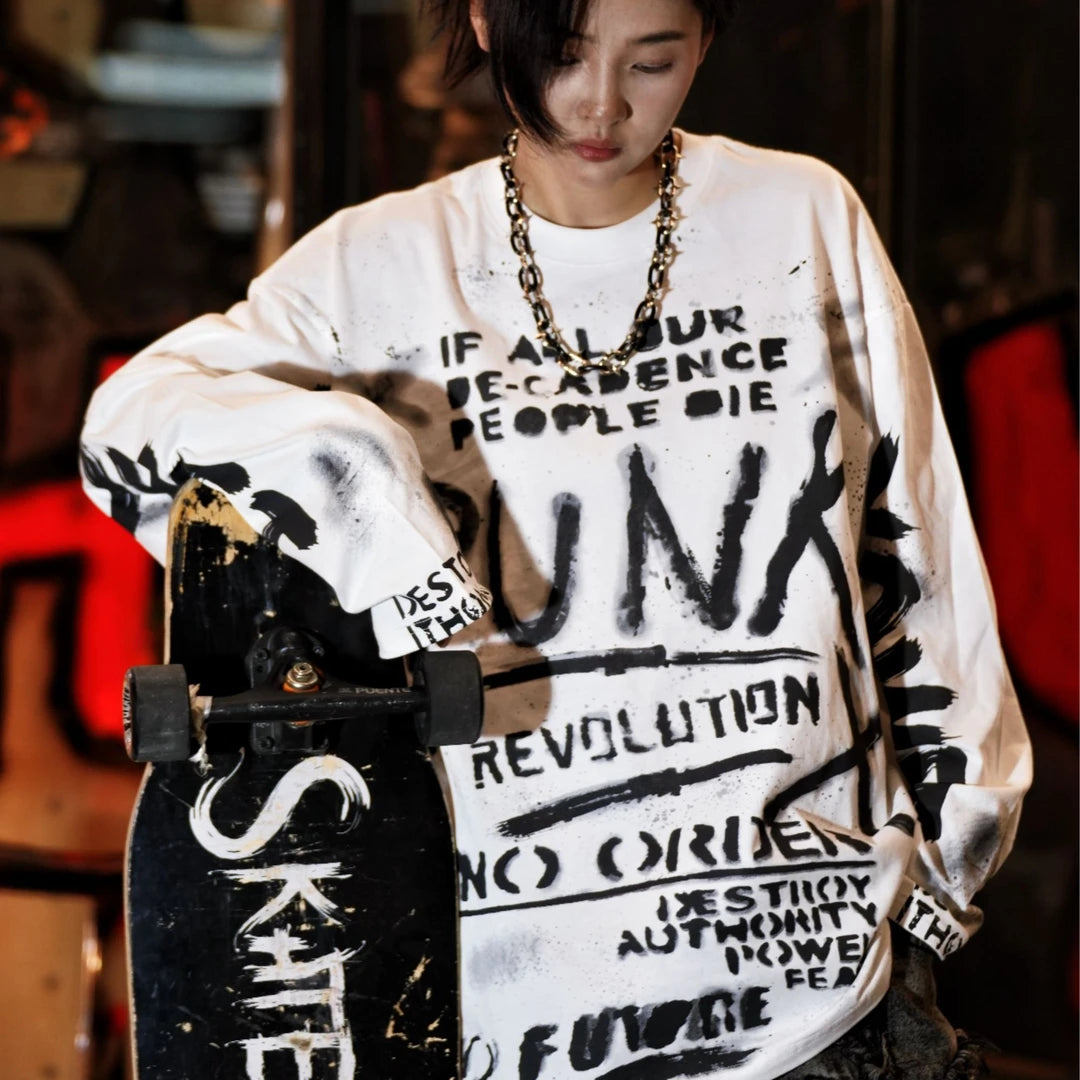Sanhoostudio long sleeve T-shirt featuring ink wash-inspired graffiti artwork, spray print detailing, and a relaxed oversized silhouette. Designed for contemporary streetwear styling with soft breathable fabric, bold artistic textures, comfortable everyday wear, and versatile urban appeal.