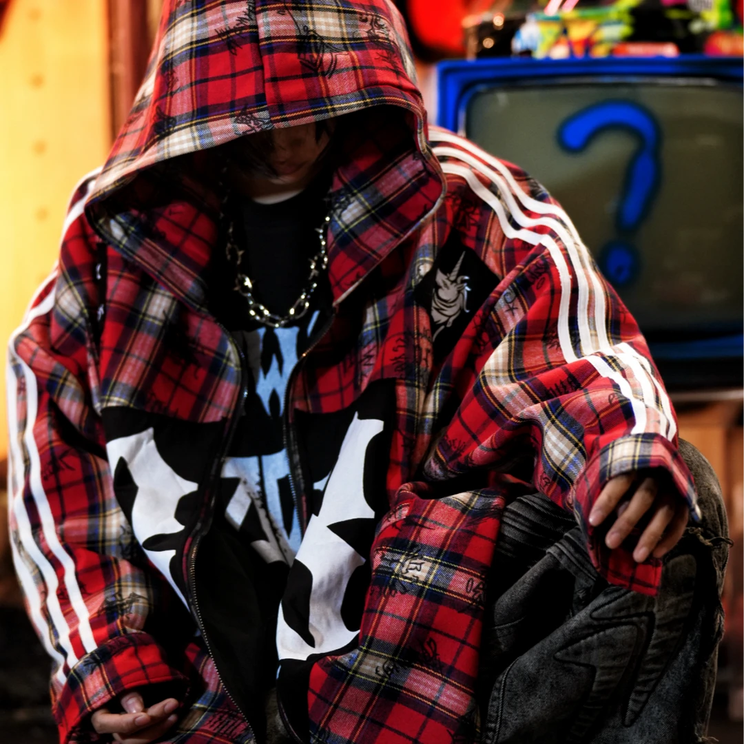 Sanhoostudio fleece-lined jacket featuring red plaid-inspired graphic detailing, digital print artwork, patchwork construction, and a relaxed oversized silhouette. Designed for fall and winter streetwear styling with comfortable warmth, distinctive contrasting textures, versatile layering, and bold contemporary appeal.