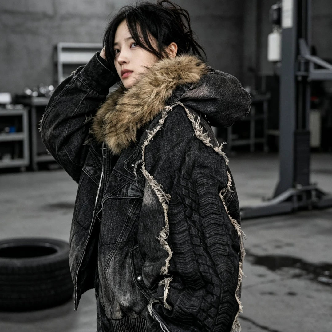 Sanhoostudio padded denim jacket featuring distinctive tire-inspired 3D embossed sleeves, heavyweight washed denim, distressed detailing, and asymmetric patchwork construction. Designed for winter streetwear styling with comfortable insulation, oversized proportions, bold dimensional textures, and distinctive deconstru