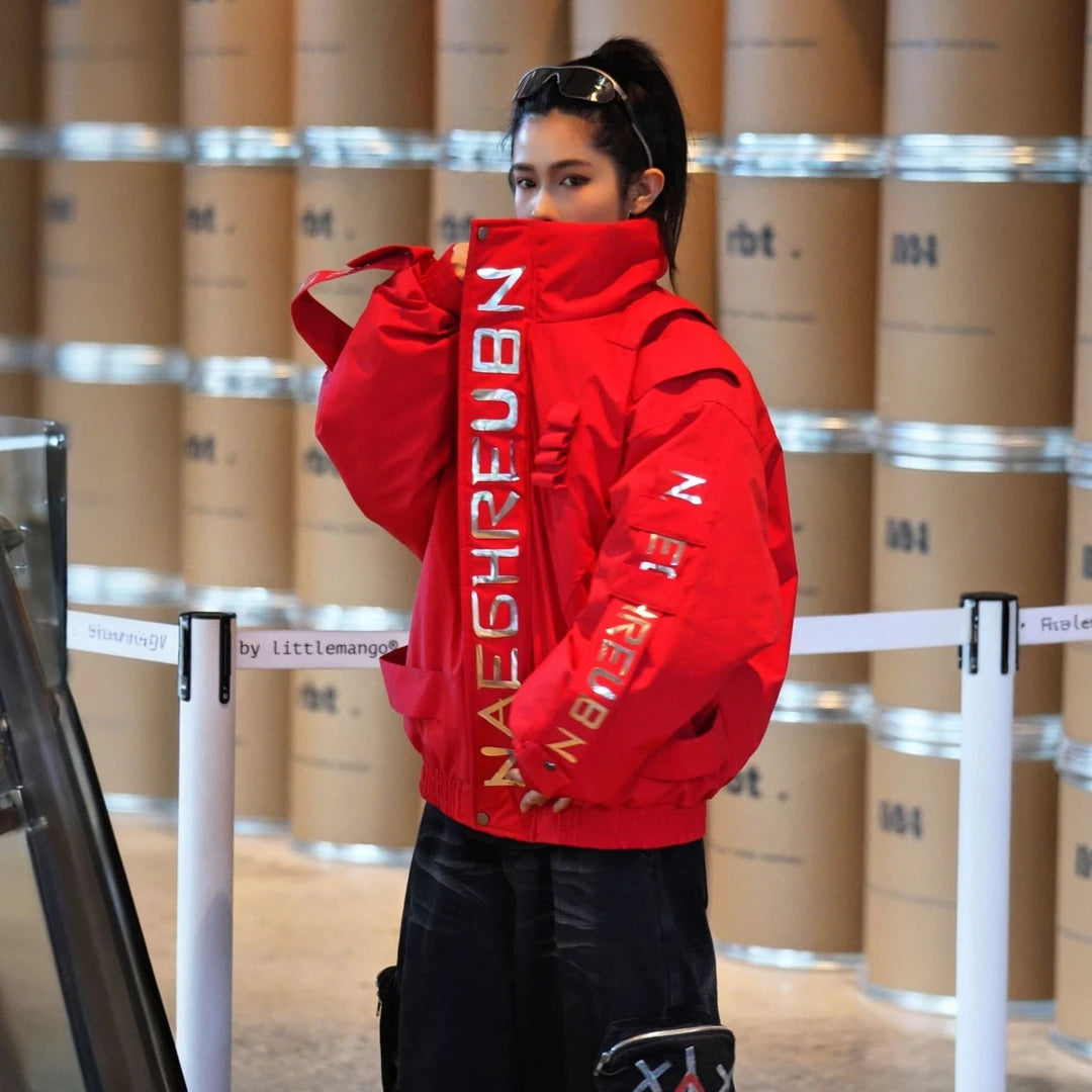 Sanhoostudio down jacket featuring reflective letter graphics, a structured stand collar, and a relaxed oversized silhouette. Designed for technical-inspired winter streetwear styling with comfortable insulation, bold reflective detailing, functional aesthetics, and versatile everyday layering.