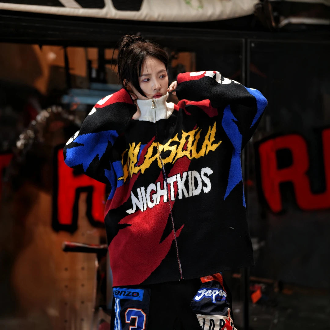 Sanhoostudio knit sweater featuring thunder-inspired contrasting colors, heavyweight knitted construction, distressed graffiti artwork, and hand-painted patchwork detailing. Designed for statement streetwear styling with a relaxed oversized silhouette, bold color combinations, comfortable warmth, and distinctive appeal