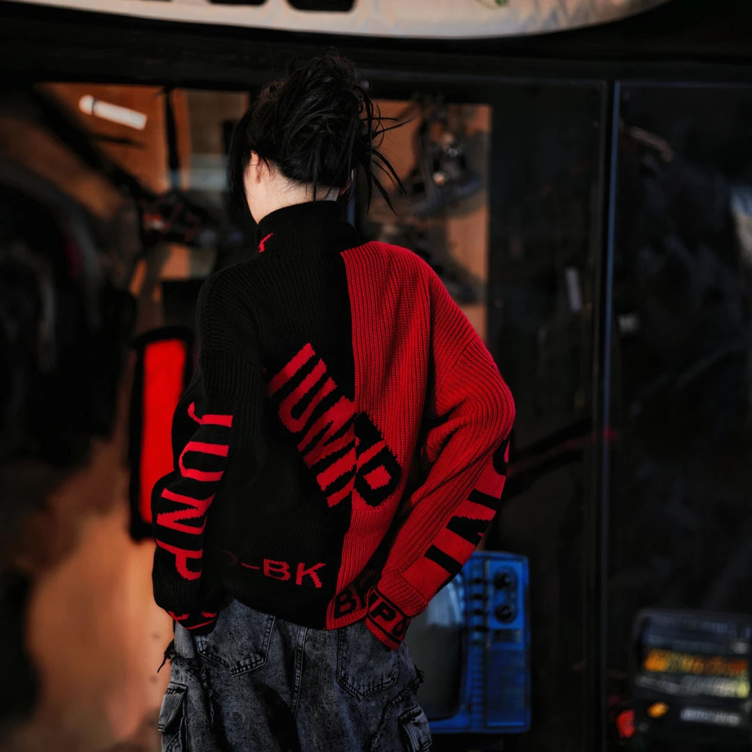 Sanhoostudio knit sweater featuring a contrasting black and red colorway, heavyweight knitted construction, subtitle-inspired graphic details, distressed graffiti artwork, and hand-painted patchwork elements. Designed with a relaxed oversized silhouette for statement streetwear styling, comfortable warmth, and appeal.
