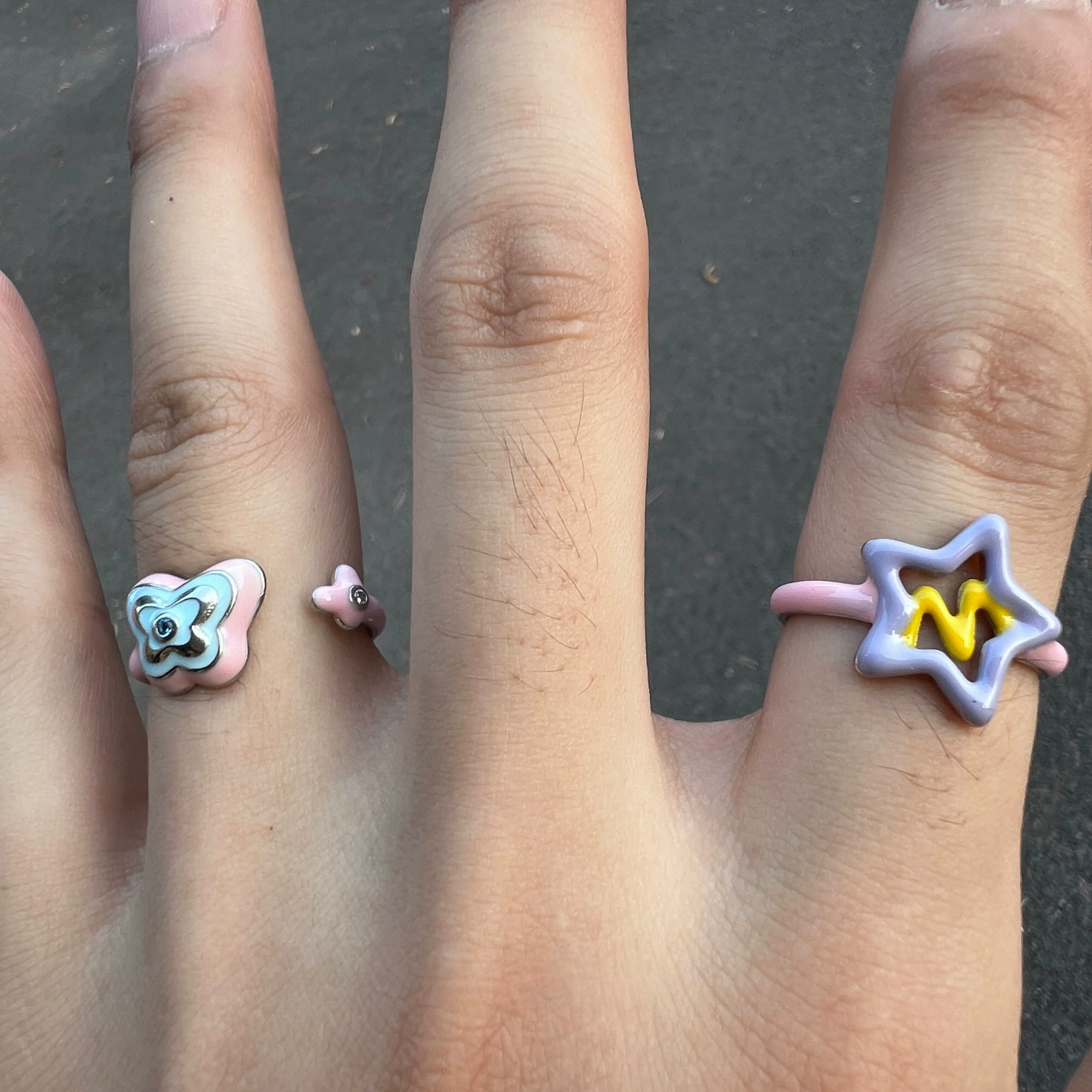 Add color with Sanhoostudio’s graffiti dopamine ring—vibrant hues and playful design bring Barbiecore energy to streetwear. A fun statement ring for bold styling and daily looks.