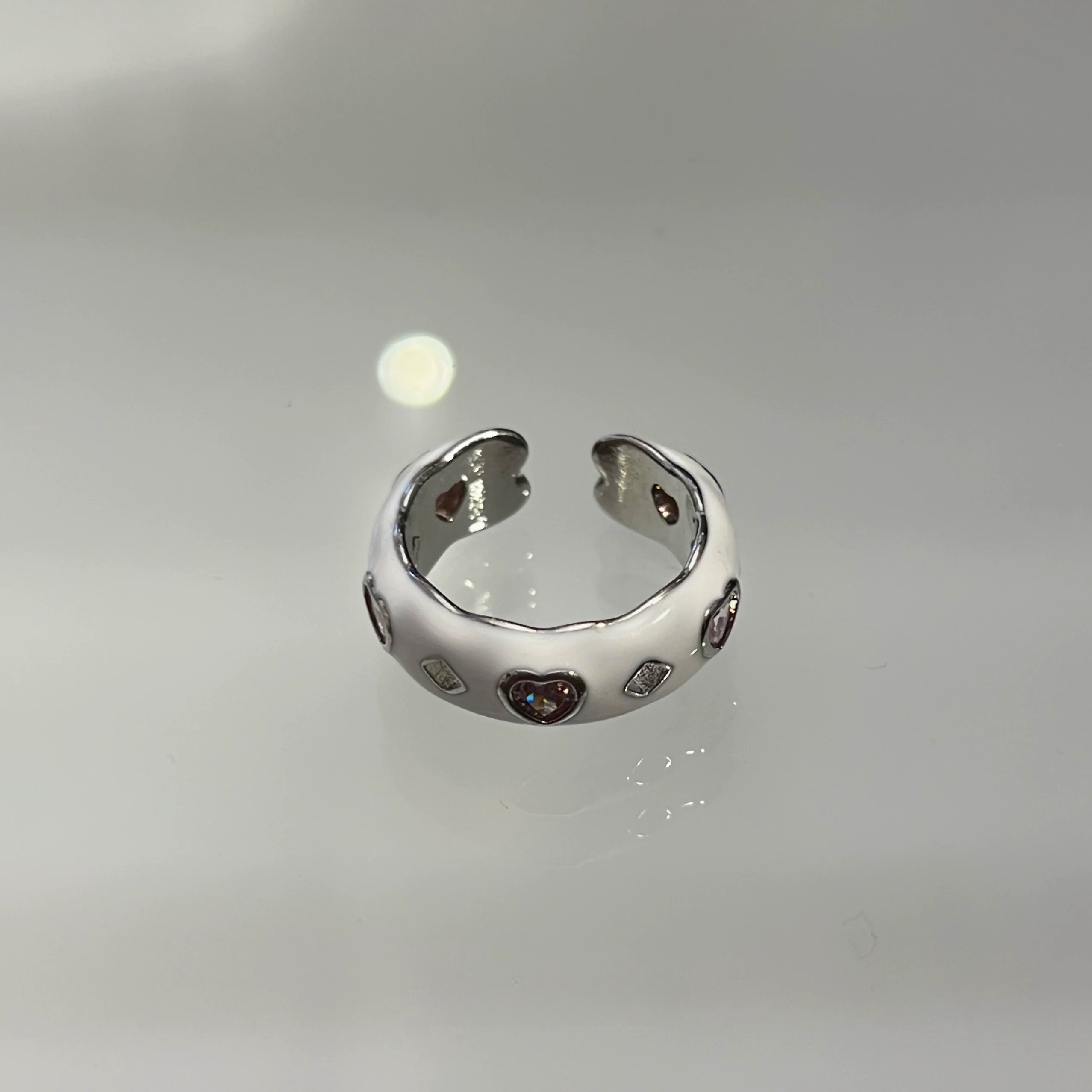 Add color with Sanhoostudio’s graffiti dopamine ring—vibrant hues and playful design bring Barbiecore energy to streetwear. A fun statement ring for bold styling and daily looks.