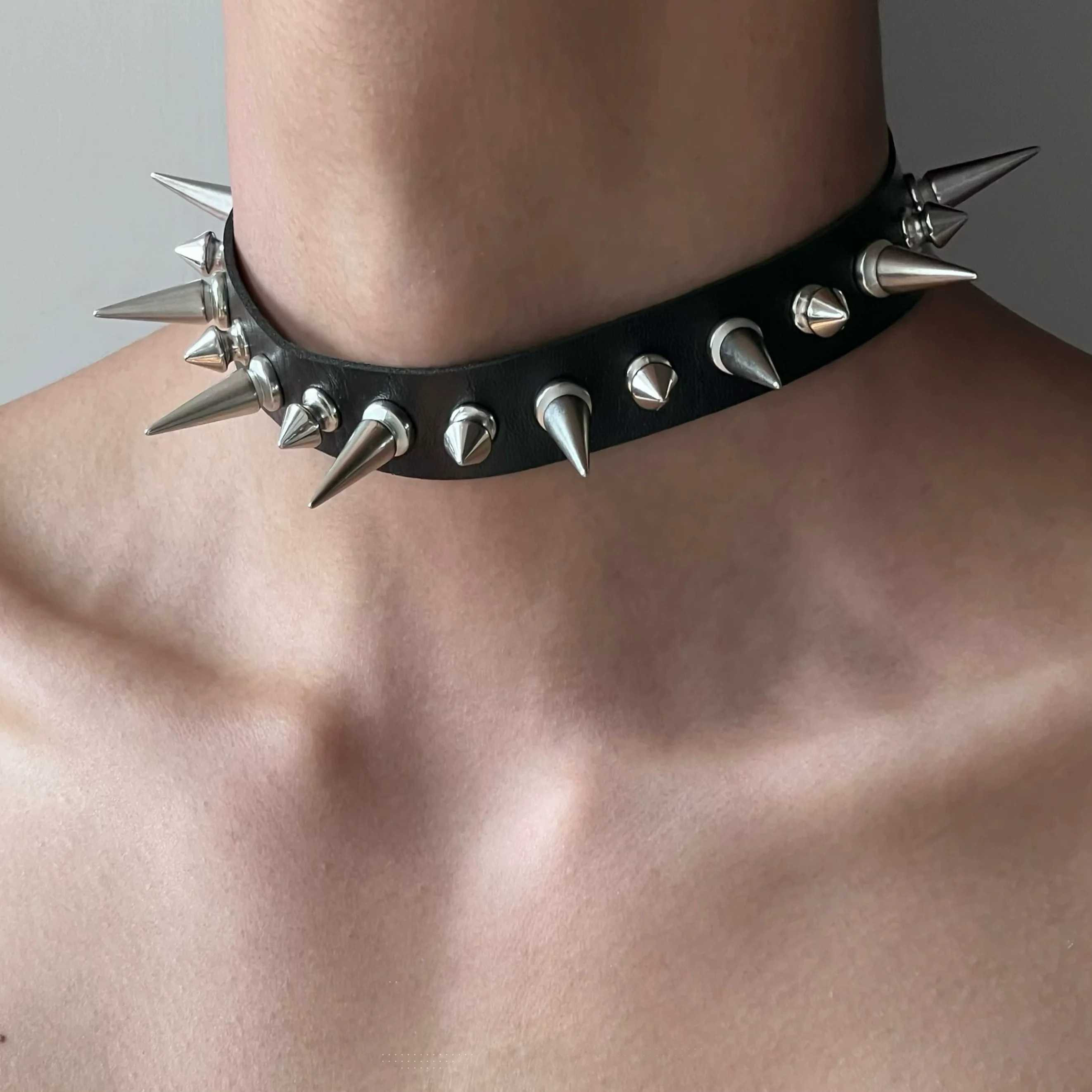 Discover Sanhoostudio’s rock studded punk leather choker, blending Y2K subculture aesthetics with bold metal detailing for a rebellious, fashion-forward accessory that elevates streetwear outfits.