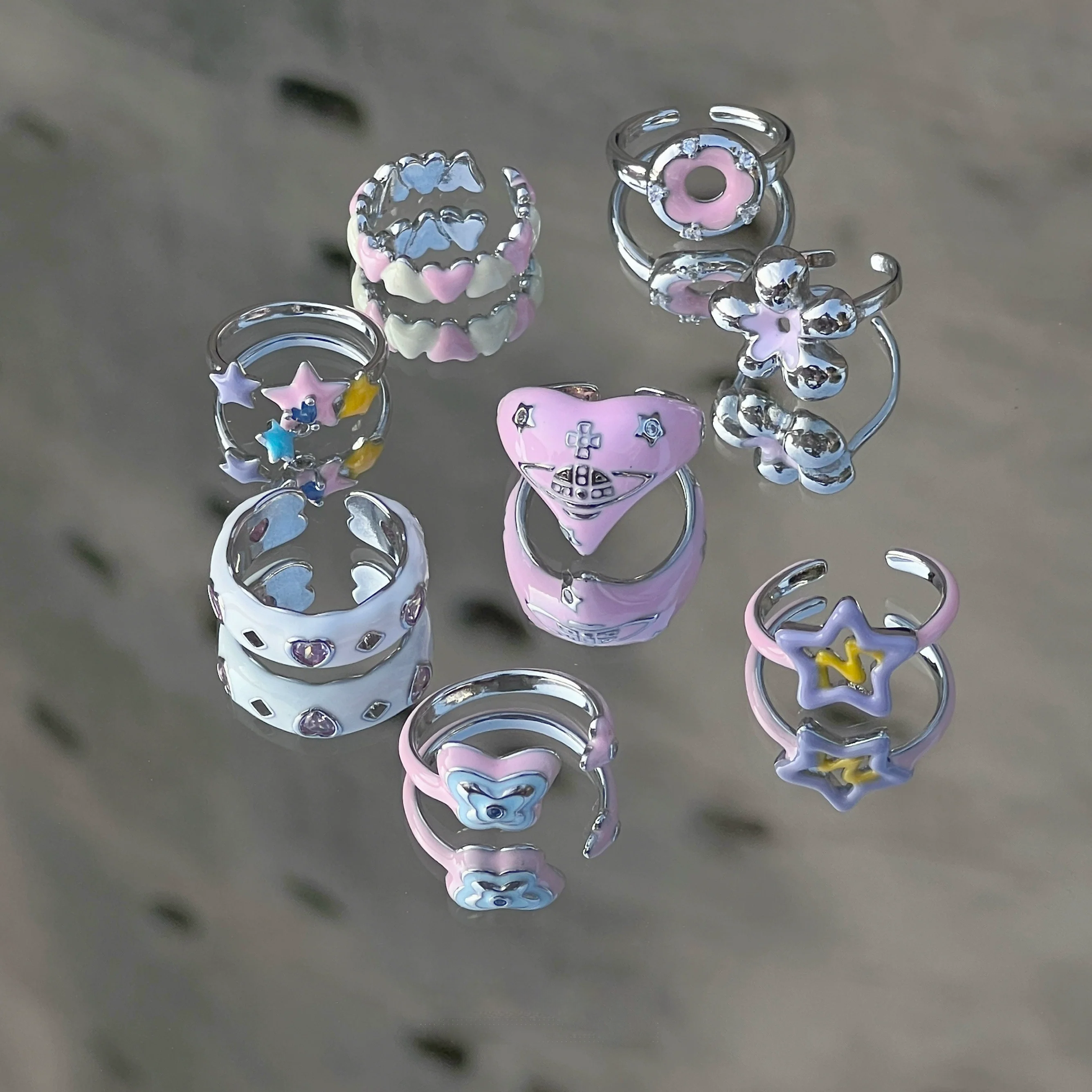 Add color with Sanhoostudio’s graffiti dopamine ring—vibrant hues and playful design bring Barbiecore energy to streetwear. A fun statement ring for bold styling and daily looks.