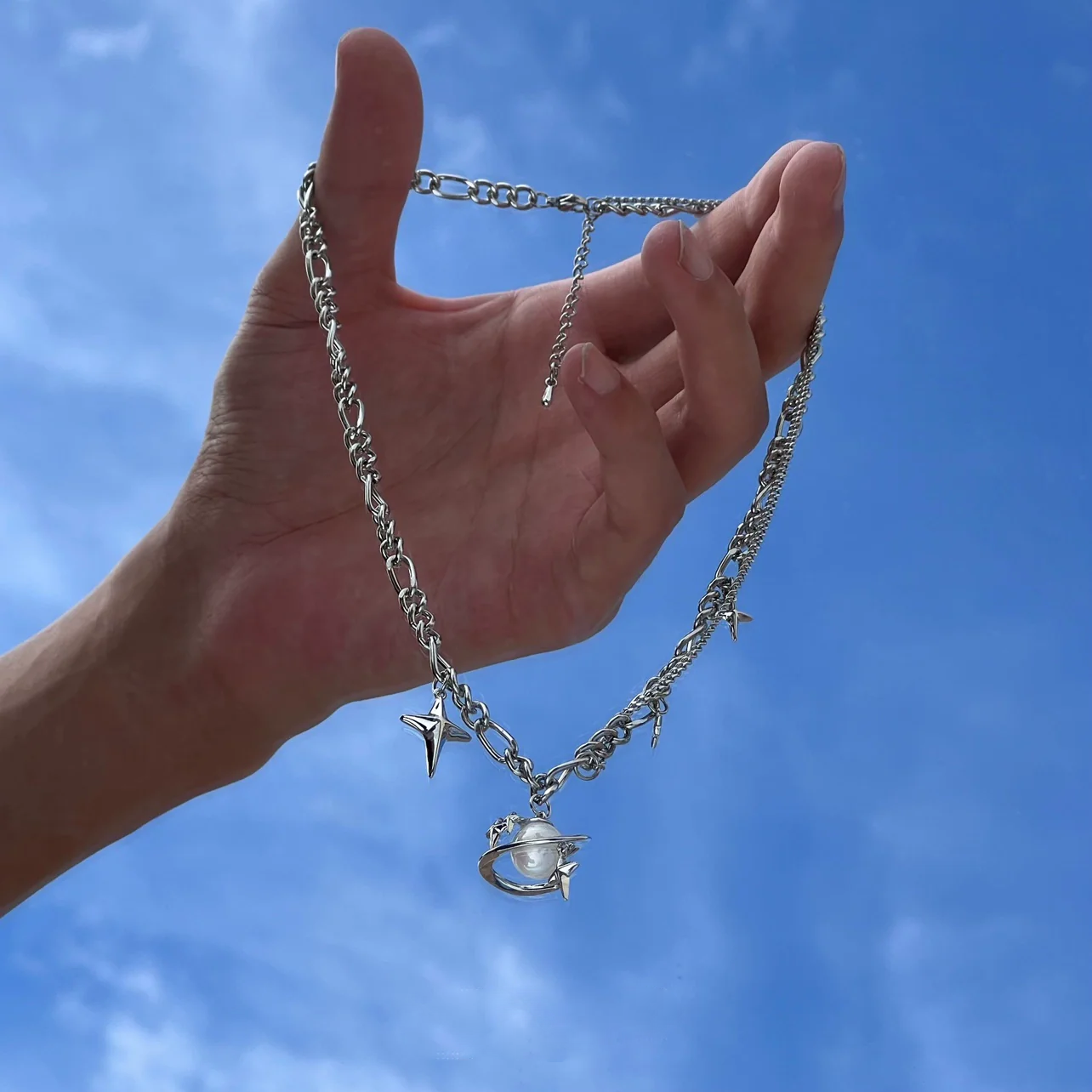 Discover the star geometric pearl layered necklace from Sanhoostudio, designed with chic pearl details and modern double chain style. Perfect for layering with streetwear or luxury outfits. Shop necklaces now at Sanhoostudio.