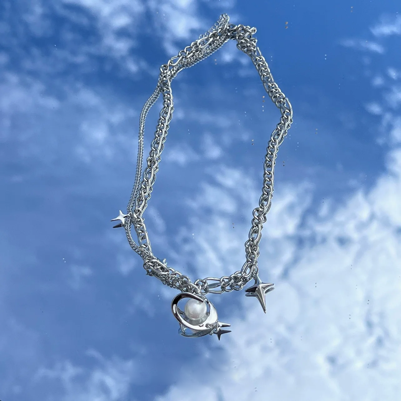 Discover the star geometric pearl layered necklace from Sanhoostudio, designed with chic pearl details and modern double chain style. Perfect for layering with streetwear or luxury outfits. Shop necklaces now at Sanhoostudio.