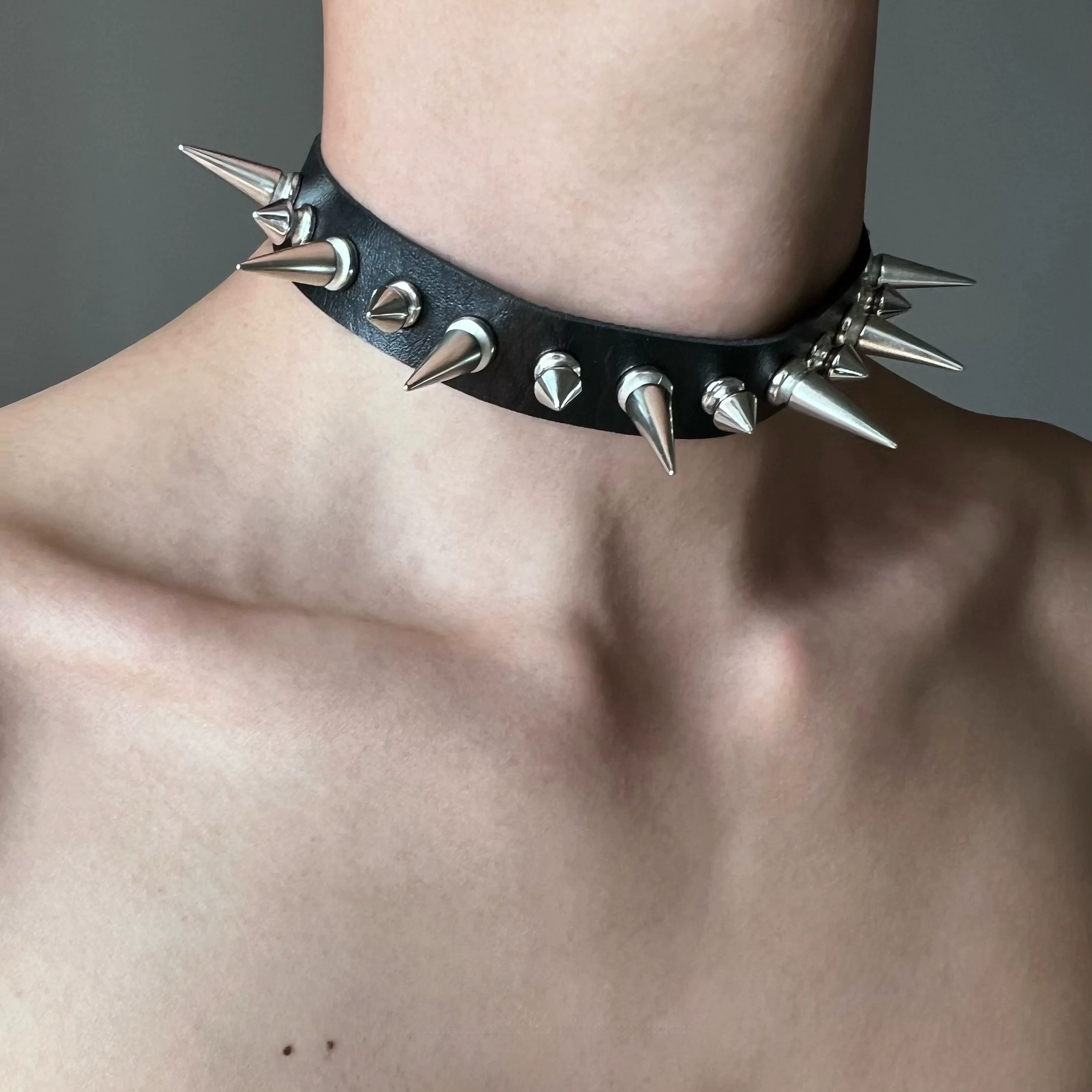 Discover Sanhoostudio’s rock studded punk leather choker, blending Y2K subculture aesthetics with bold metal detailing for a rebellious, fashion-forward accessory that elevates streetwear outfits.