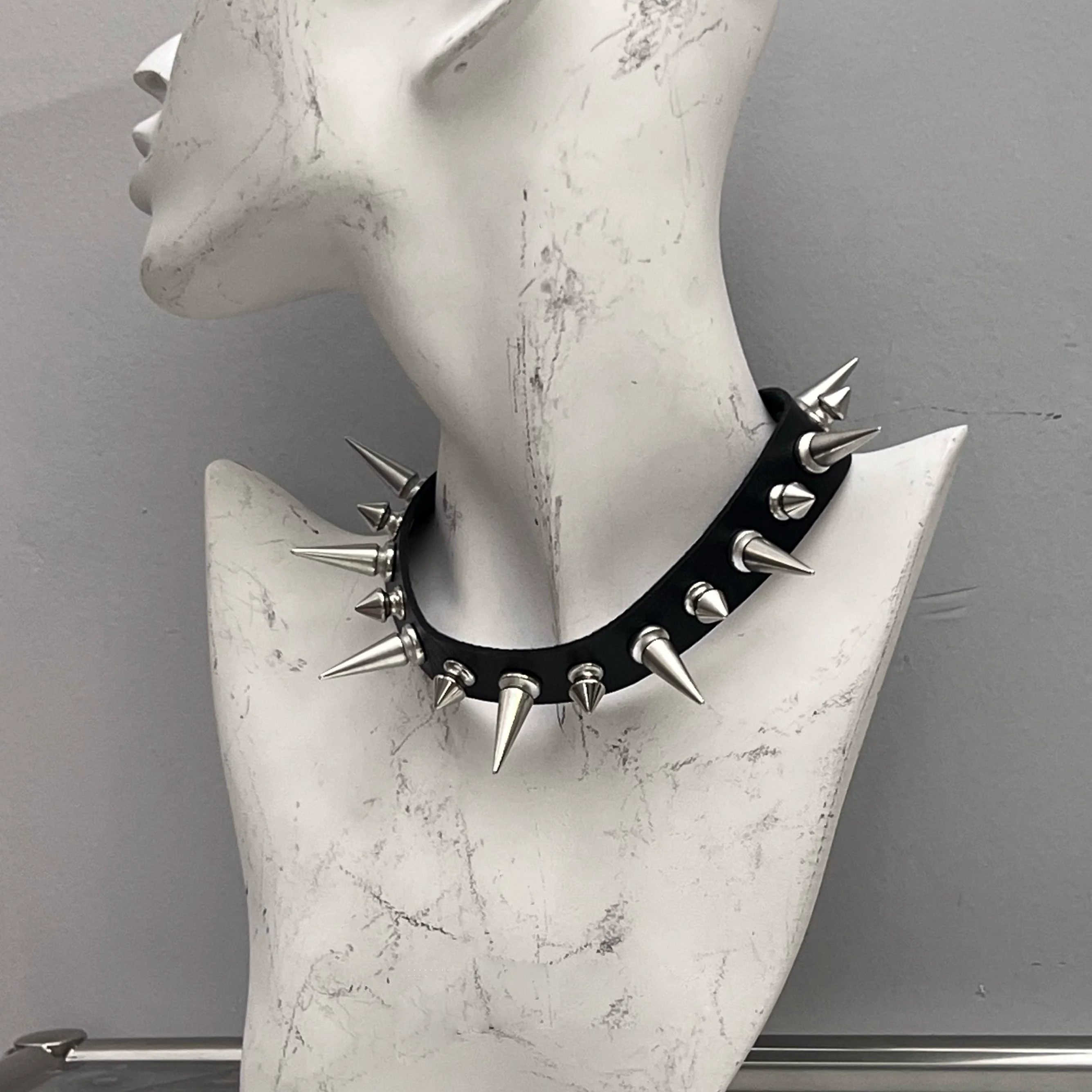 Discover Sanhoostudio’s rock studded punk leather choker, blending Y2K subculture aesthetics with bold metal detailing for a rebellious, fashion-forward accessory that elevates streetwear outfits.