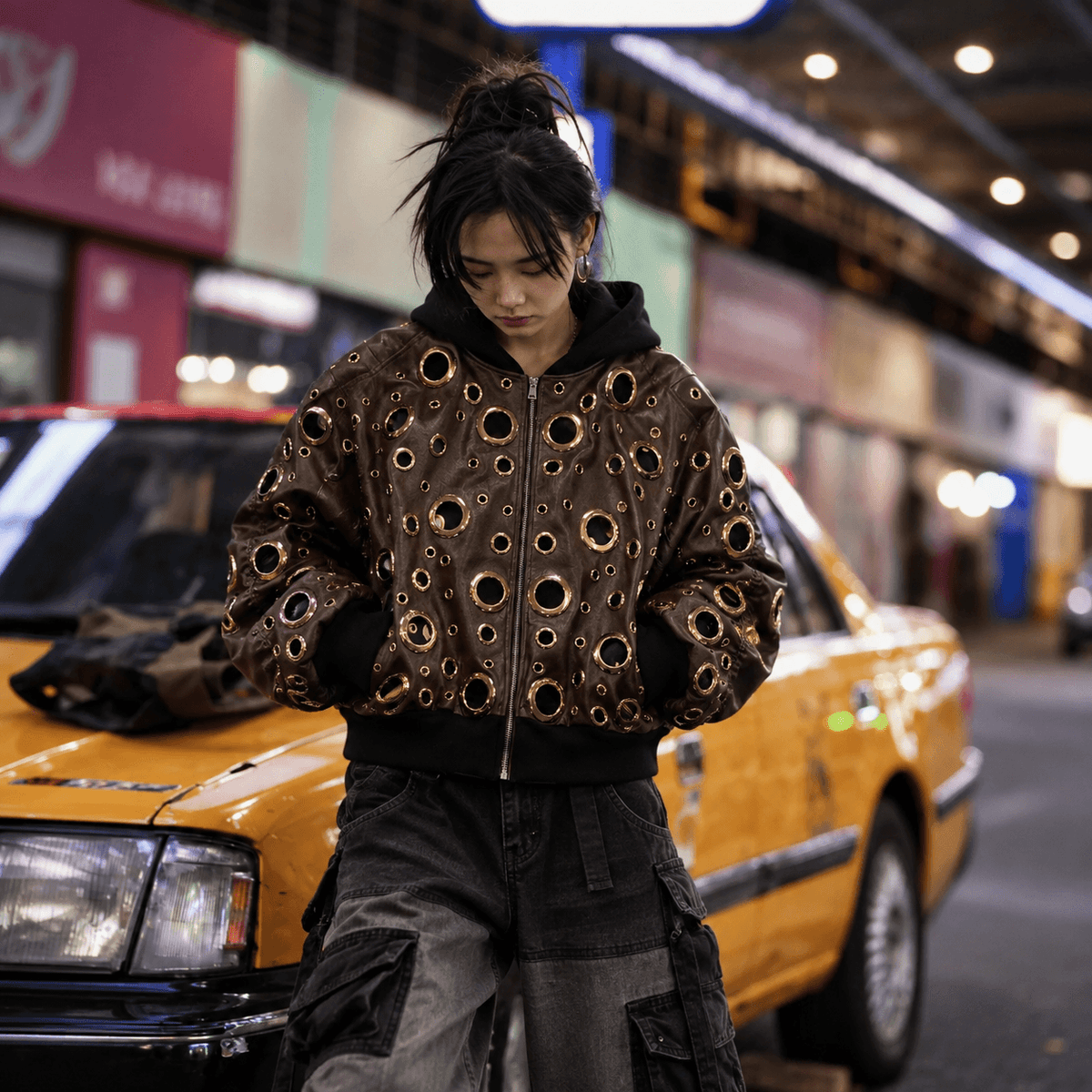 Sanhoostudio PU leather jacket featuring statement cutout detailing, a layered two-piece effect, and a relaxed oversized silhouette. Designed for contemporary streetwear layering with dimensional construction, bold visual contrast, and distinctive motorcycle-inspired urban styling.