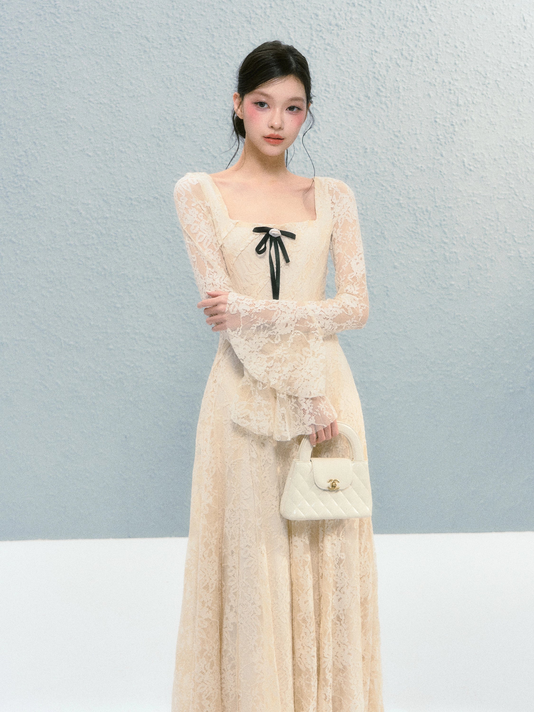 Sanhoostudio presents the Lace Bow Long Sleeve Dress, a charming piece with lace and bow accents, perfect for birthdays and autumn gatherings.