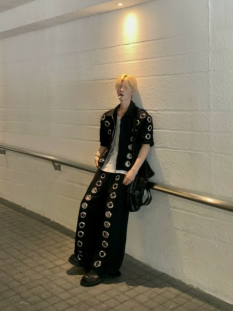 The Sanhoostudio two-piece set combines a cropped hoodie with metal ring hollow details and a matching bottom for a coordinated high street look. With its relaxed fit and edgy design, this set delivers both comfort and standout individuality for streetwear enthusiasts.