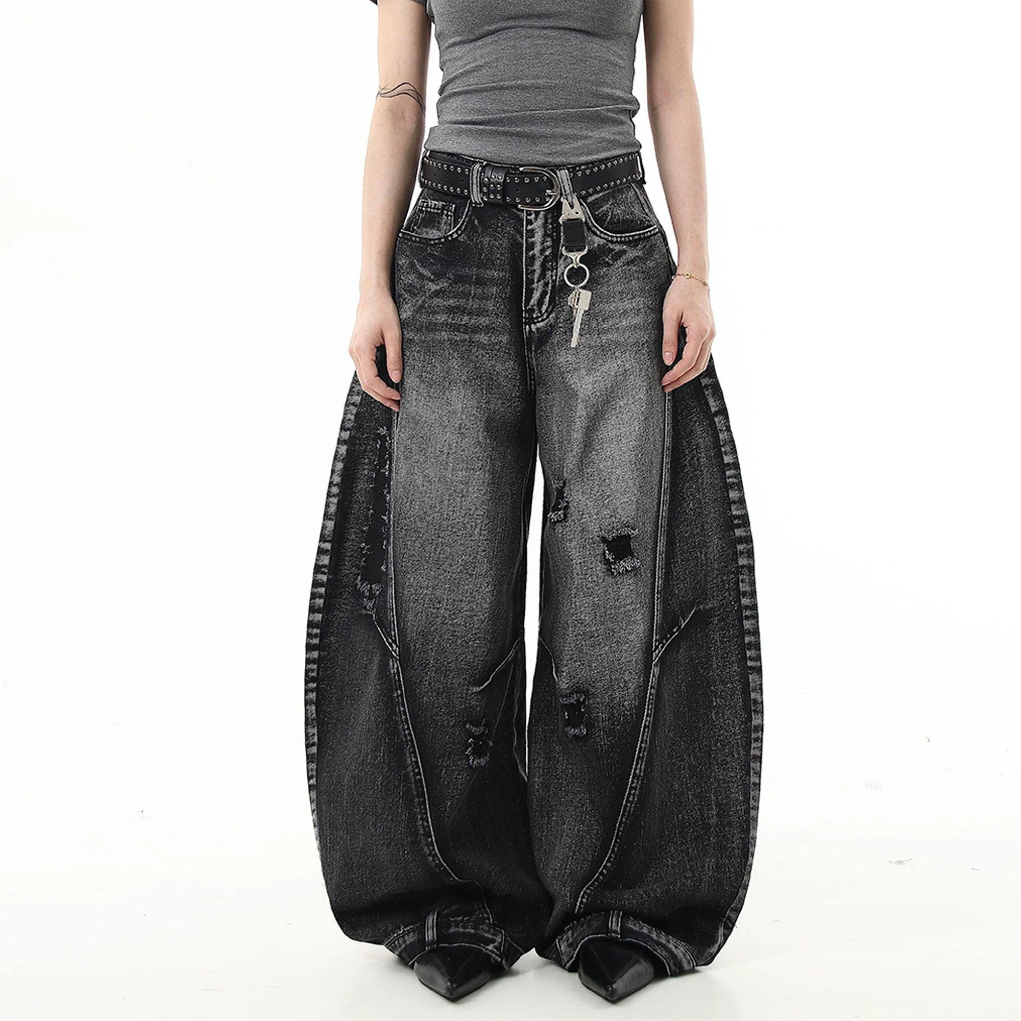 Sanhoostudio wide leg denim pants featuring washed distressing and ripped details. Designed with a curved scythe silhouette for modern high street fashion.